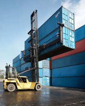 Forklift lifting container Stock Photos