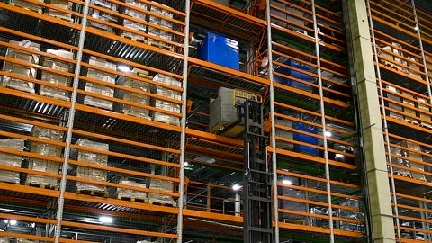 Forklift lifting container in a warehouse. Stock Footage 341790203