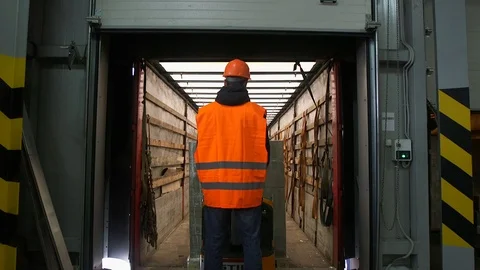 Forklift loader load boxes into a truck Stock Footage 91128974