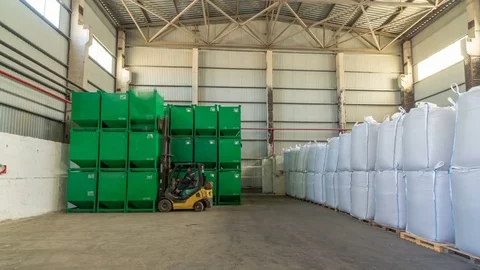 Forklift loader at work timelapse hyperlapse moves green container at warehouse Stock Footage