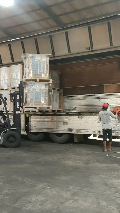 Forklift Loading Cargo Onto Truck Stock Footage 303370080