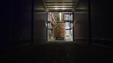 Forklift Loading Merchandise in the Semi Trailer Stock Footage 264646920
