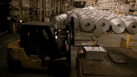 Forklift in Modern steel mill picking up raw ore Stock Footage 89944512