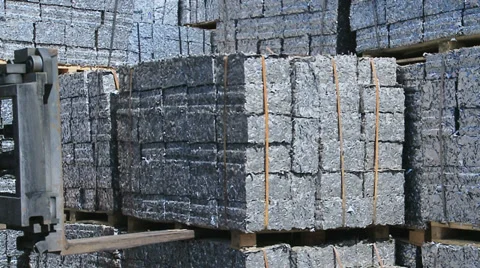Forklift moves aluminum Scrap Cubes for recycling Stock Footage
