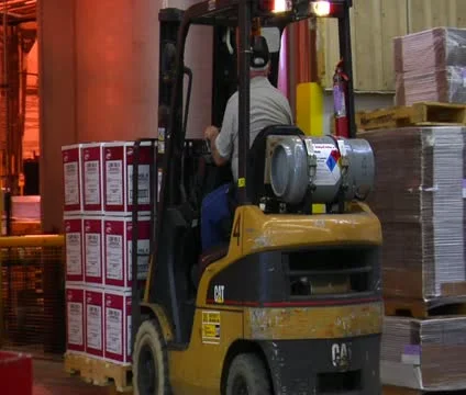 Forklift moves pallets of boxes Stock Footage 21590693