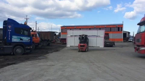 Forklift moving materials in shipping yard Stock Footage 48869465
