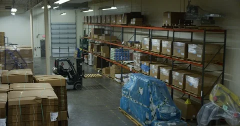 Forklift moving pallets in a warehouse Stock Footage 103999281