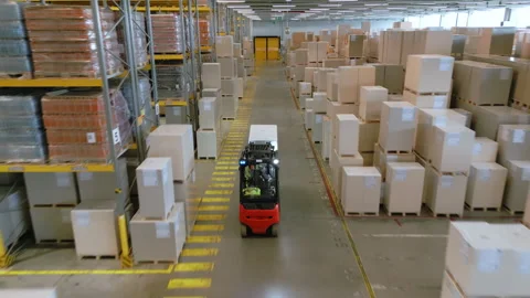 A forklift navigates warehouse, optimizing logistics and storage efficiency. Stock Footage 307959606
