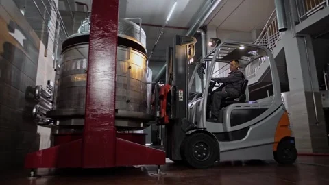 Forklift operation under the control of an experienced driver in a winery Stock Footage 268750640