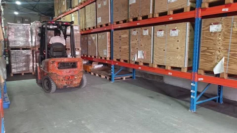 Forklift operator in Abidjan warehouse. Stock Footage 319828648