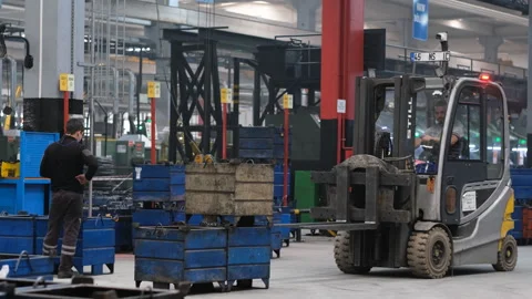 A forklift operator efficiently moves heavy loads Stock Footage 325338188