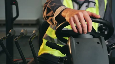 Forklift Operator Hand on Steering Wheel and Control Levers. Stock Footage 345314640