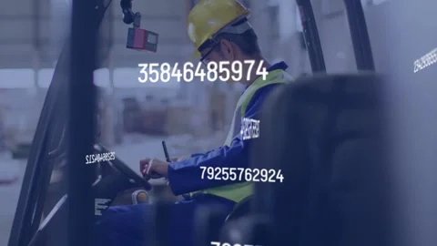 Forklift operator tapping phone and adjusting controls in warehouse, data Stock Footage 334788797
