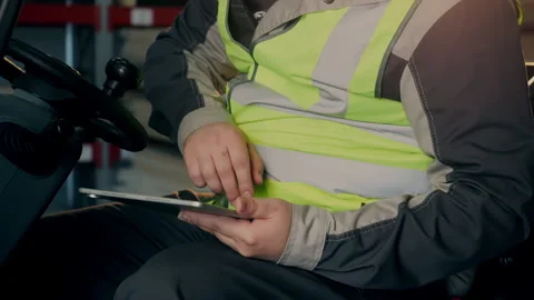 Forklift Operator Using Digital Tablet for Warehouse Logistics Management 動画素材 345013290