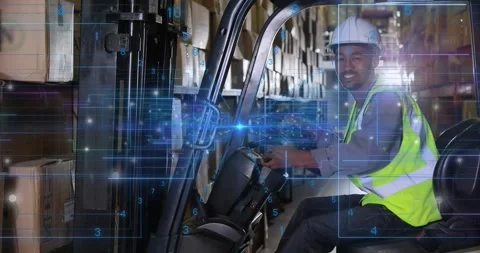 Forklift operator in warehouse checking load and lifting pallet with overlay Video stock 319681659