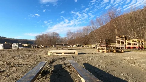 Forklift picking up and stacking pallets Stock Footage 129049880