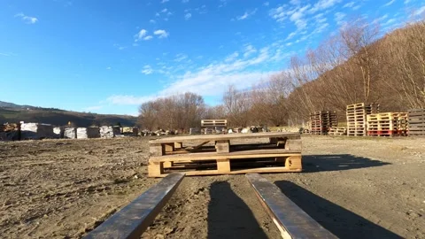 Forklift picking up and stacking pallets Stock Footage 129051811