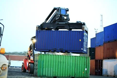 Forklift Picking up Container Stock Photos