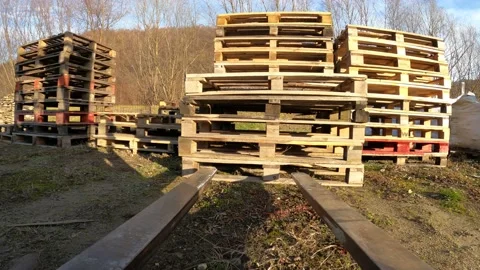 Forklift picking up stack of pallets Stock Footage 121724770