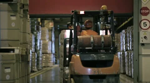 Forklift Small cargo truck drives to warehouse Stock Footage