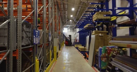 Forklift Unloading Stack Of Boxes on a shelf Stock Footage 126953450