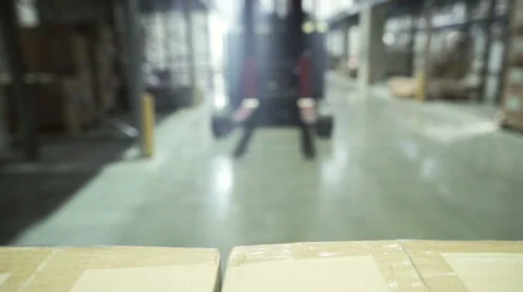 Forklift using a pallet transporter in a warehouse Stock Footage 67336336