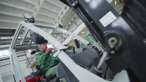 Forklift Worker in a Large Warehouse Stock Footage 197115637