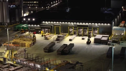 Forklifts Organizing Materials in a Well-Lit Dublin Warehouse Yard Stock Footage 332444640