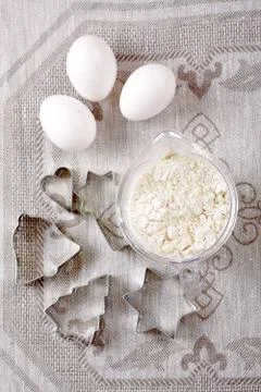 Form for baking, flour and eggs. we prepare cookies. Stock Photos