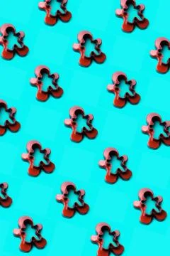 A form for cutting a gingerbread man standing on a blue emerald background Foto stock
