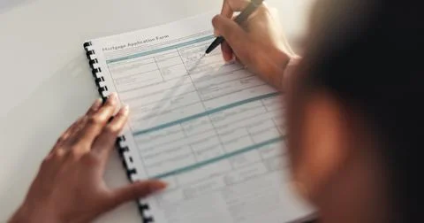 Form, document and hands writing on application for mortgage investment, legal Stockfoto's