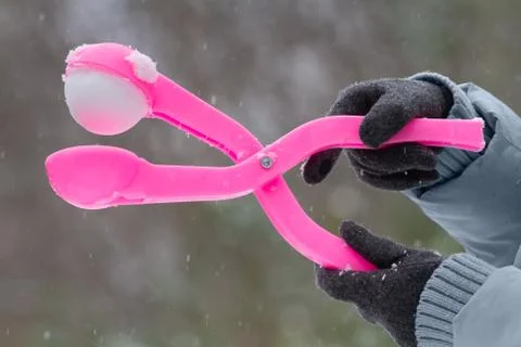 Form for making a snowball in hands Stock Photos