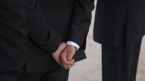 Formal Attire with Hands Clasped Behind the Back, Signifying Professional Stock Footage 314575399