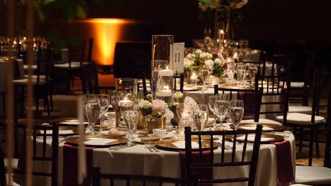 Formal luxury wedding table setting with candles, gold plates and, flowers 動画素材 104820246