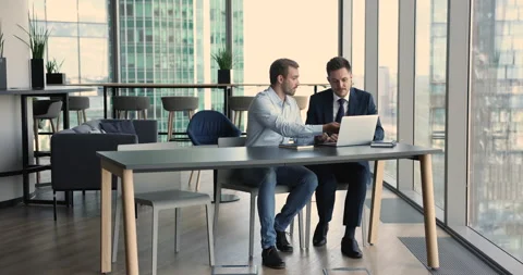 Formal meeting of client and sales manager in skyscraper office Stock-Footage 234054099