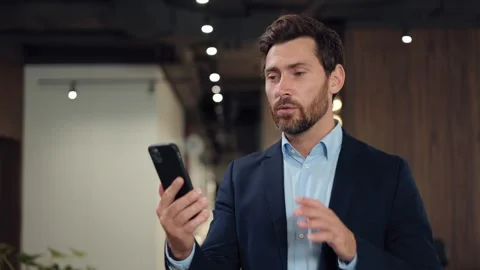 Formally dressed developer discussing project details during video call 스톡 동영상 251805718