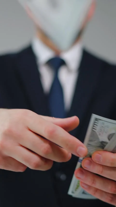 Formally dressed man carelessly throws US Dollar bills towards the camera Video stock 343571671