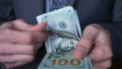 Formally dressed man counting dollars. Hands of bussinessman counting banknotes Stock Footage 234074287