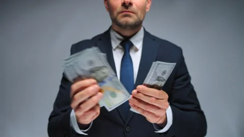Formally dressed man counting US Dollar bills, close-up. Stock Footage 260206037