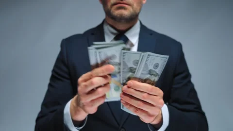 Formally dressed man counting US Dollar bills, close-up. Stock Footage 273029964
