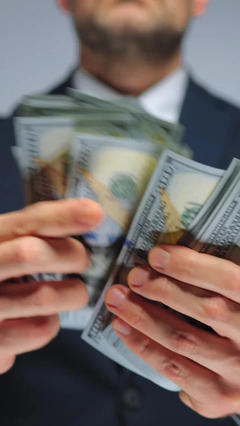 Formally dressed man is counting US Dollar bills, close-up. Stock Footage 283018909