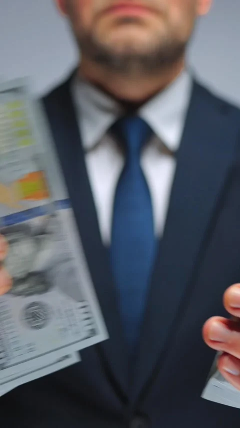 Formally dressed man counting US Dollar bills, close-up. Stock Footage 316159701