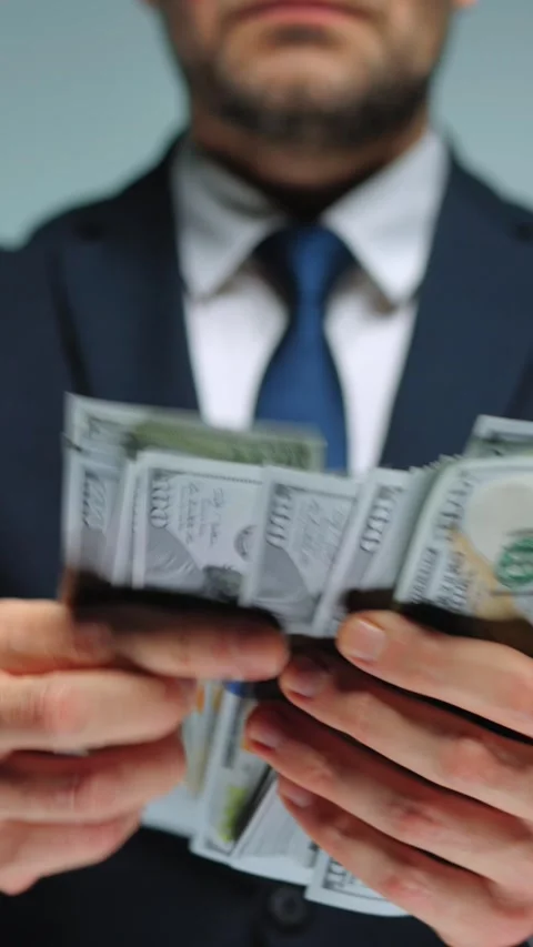 Formally dressed man counting US Dollar bills, close-up. Stock Footage 317717641