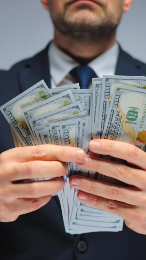 Formally dressed man counting US Dollar bills, close-up. Stock Footage 320400182