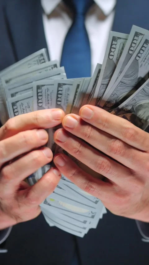 Formally dressed man counting US Dollar bills, close-up. Stock Footage 322535331