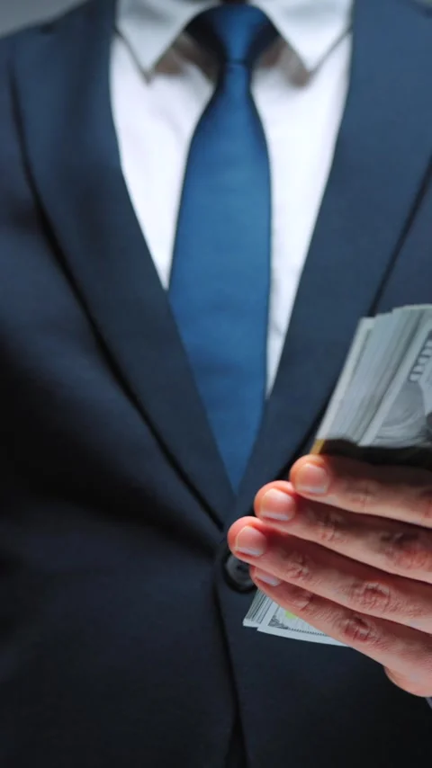 Formally dressed man is counting US Dollar bills, close-up. Stock-Footage 342833474