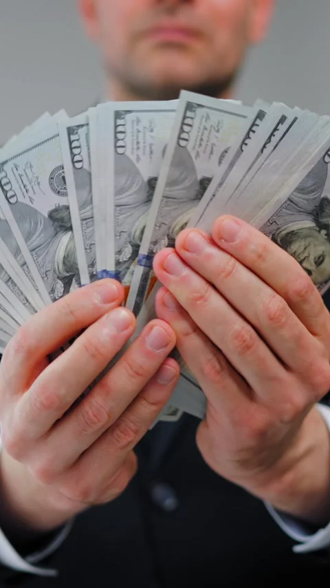 Formally dressed man is counting US Dollar bills, close-up. Stock Footage 342833807