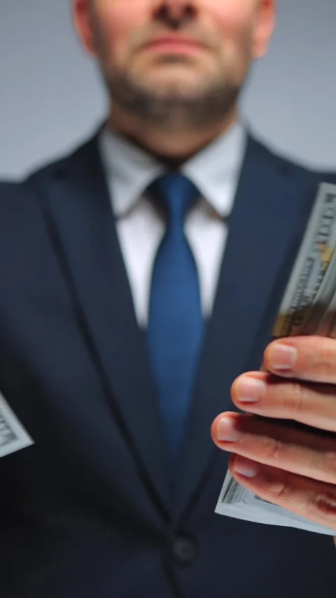Formally dressed man is counting US Dollar bills, close-up. Video stock 342835630
