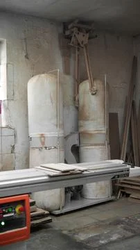 Format cutting machine and chip bag in a carpentry workshop Stock Photos