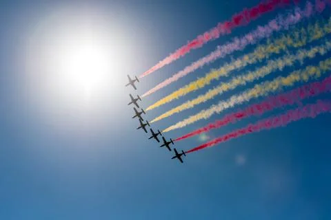 Formation of air planes on the blue cloudy sky during the airshow Stock Photos